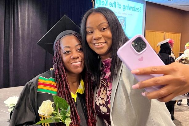 Graduate and friend taking a selfie